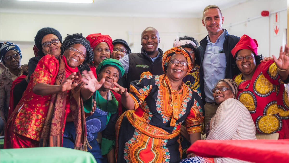 Community members gathered together in a photograph shared by Uthando