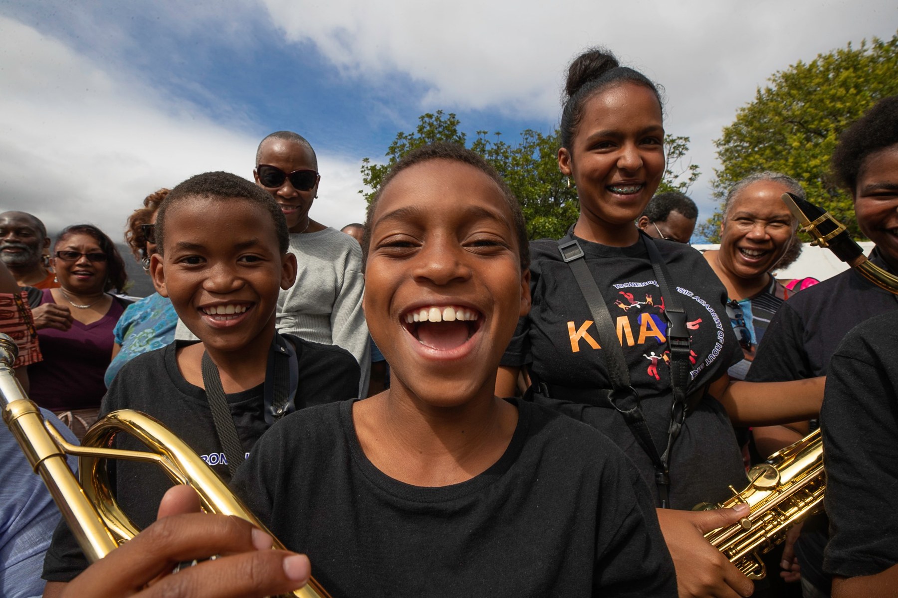 Kronendal Music Academy pupils smiling with their brass instruments