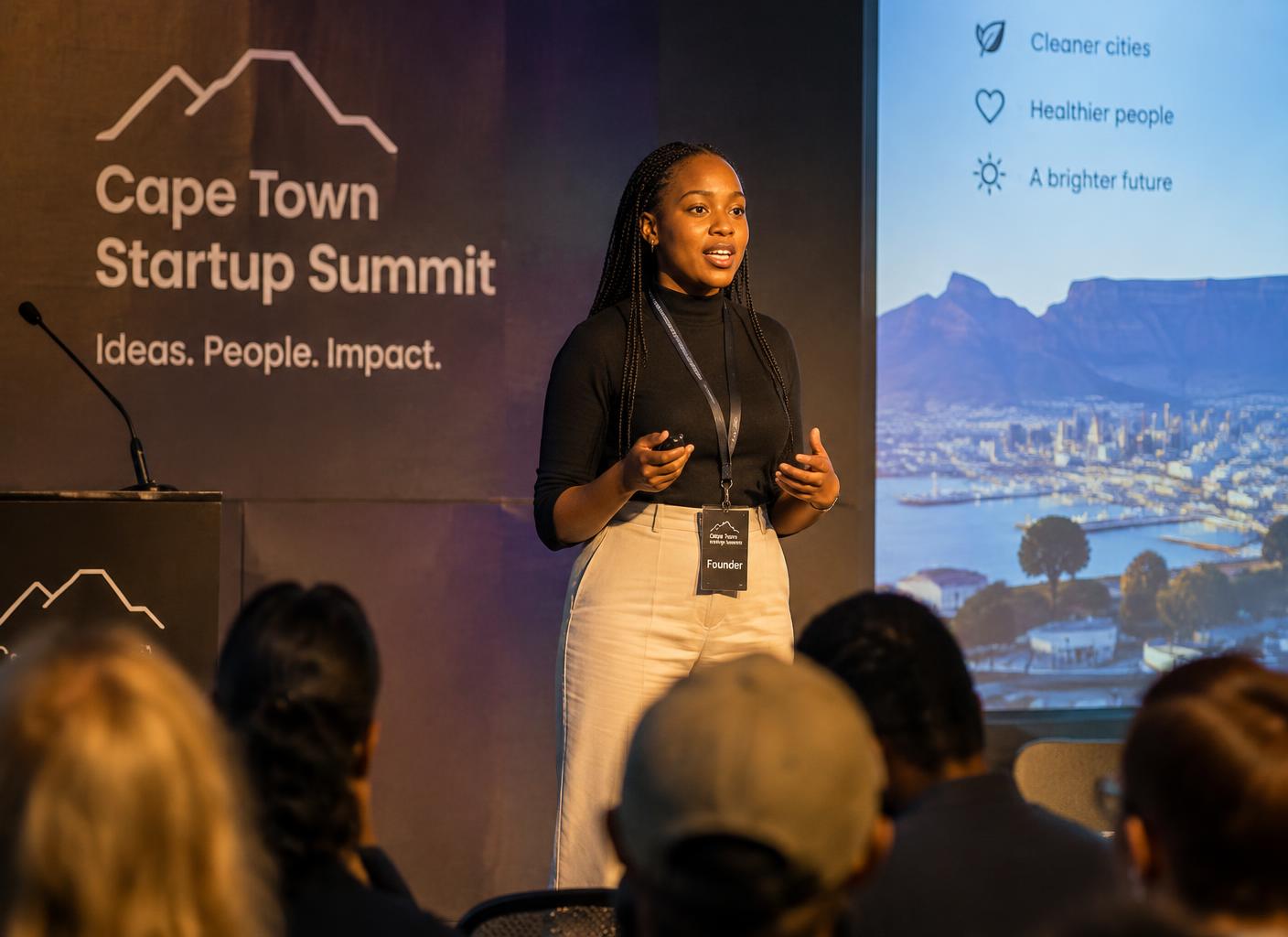 AI-generated illustration of a young founder pitching on stage at a Cape Town startup event